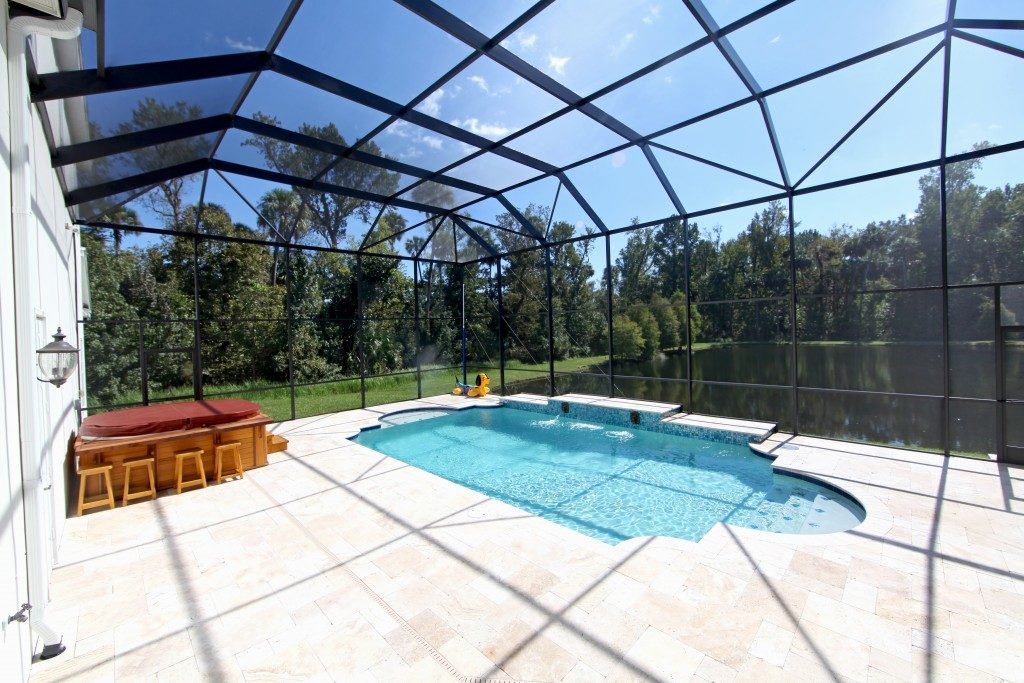 covered pool with lake view