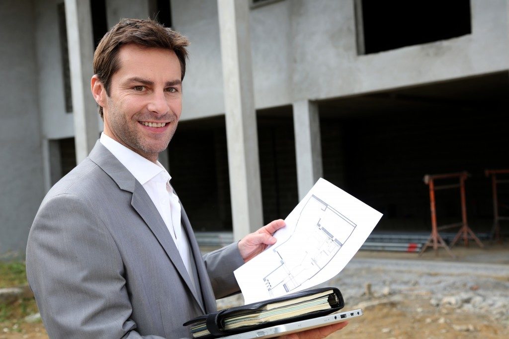 real estate agent holding a document