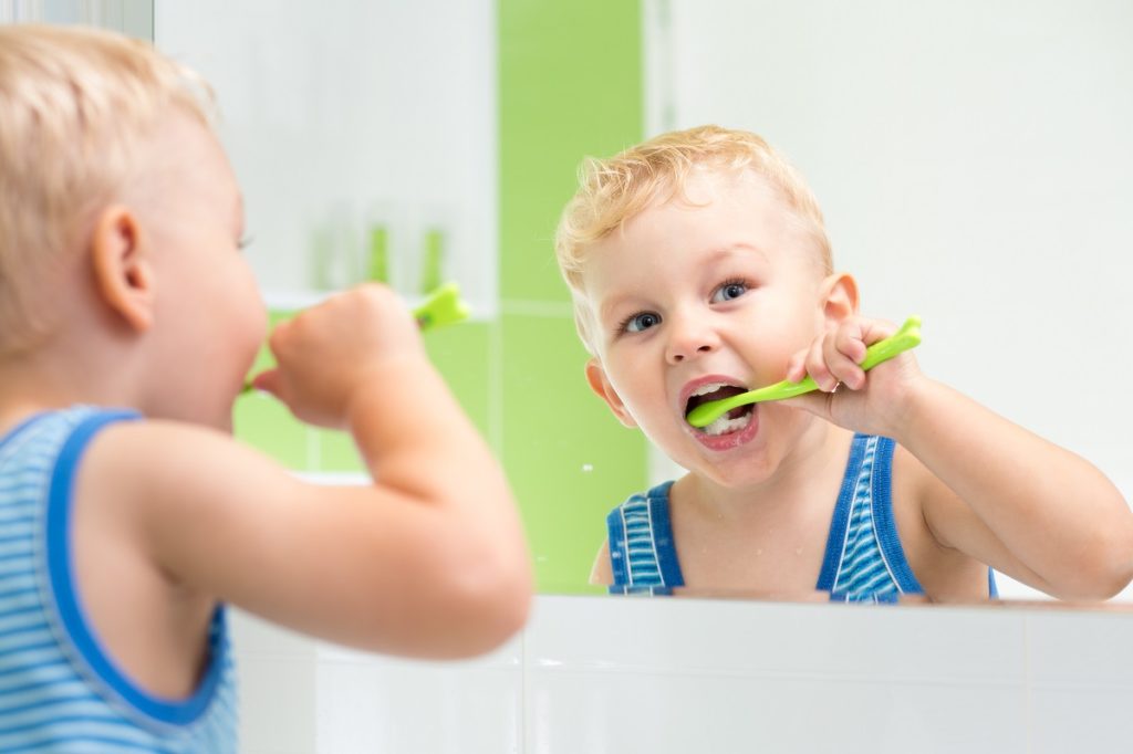 kid brushing teeth