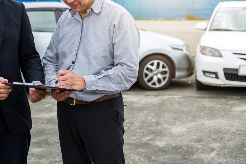 signing papers after car accident