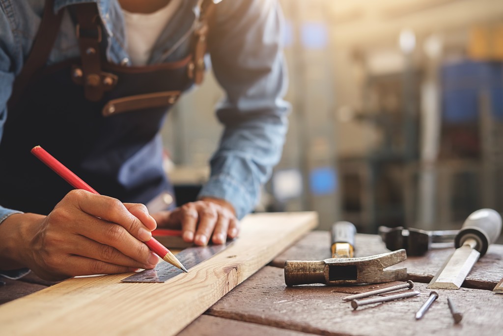 man doing wood work