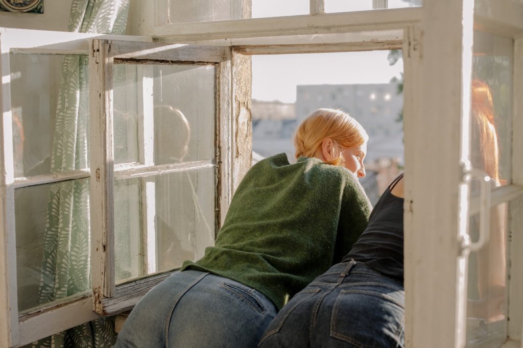 women looking out a window