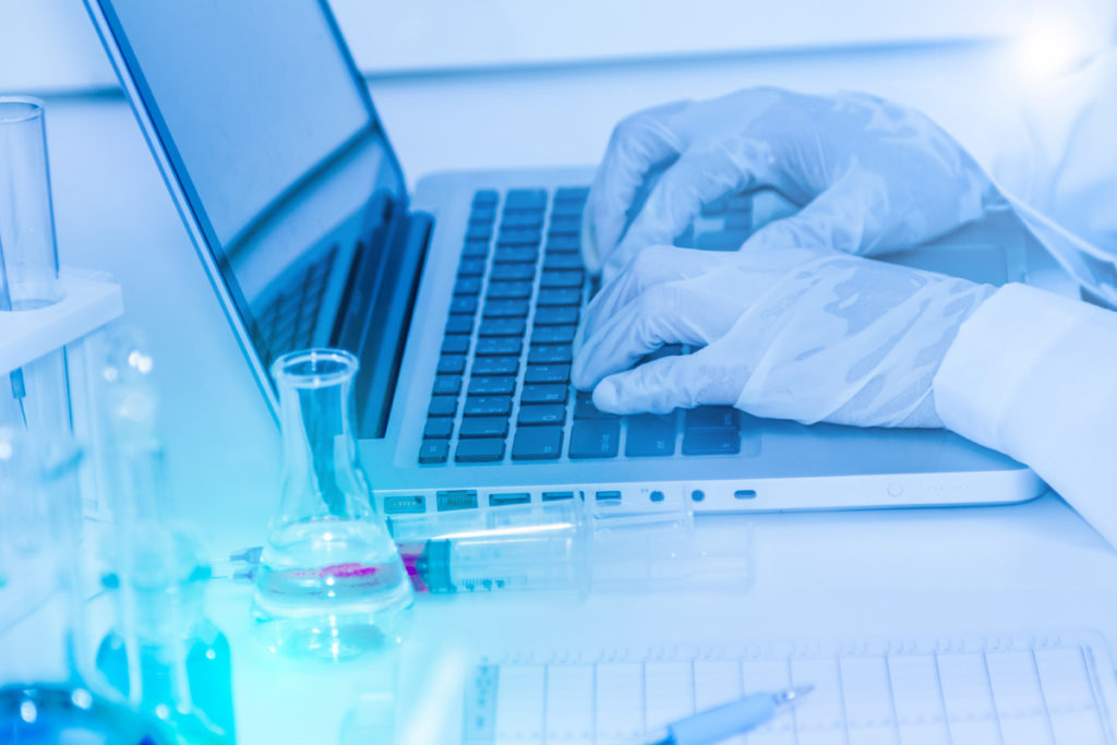 scientist working on a laptop