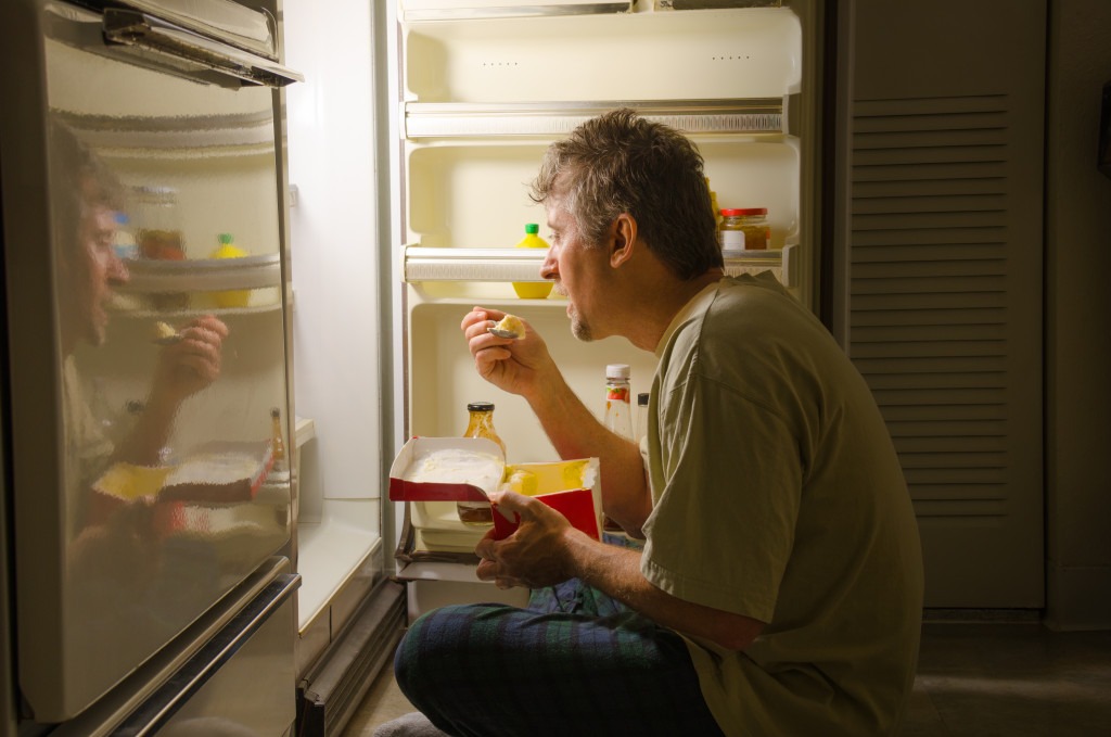 man having a midnight snack