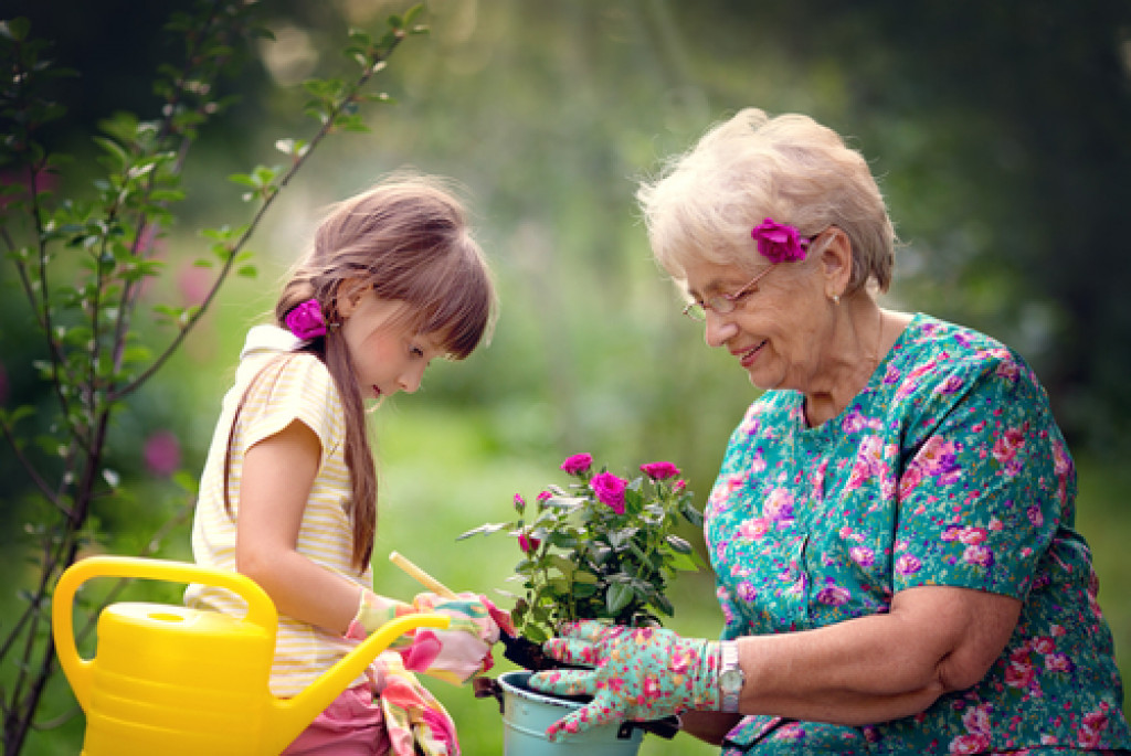 child and granddaughter gardening