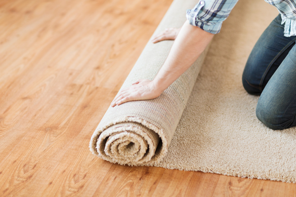 putting carpet on top of a wooden floor
