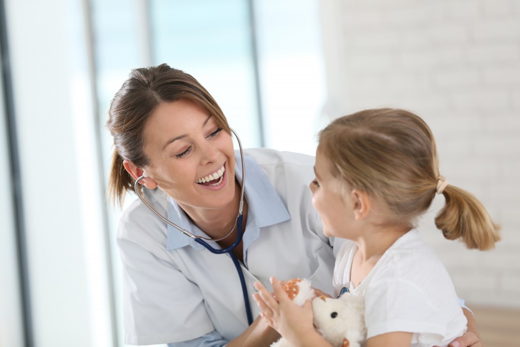 pediatrician smiling at a child