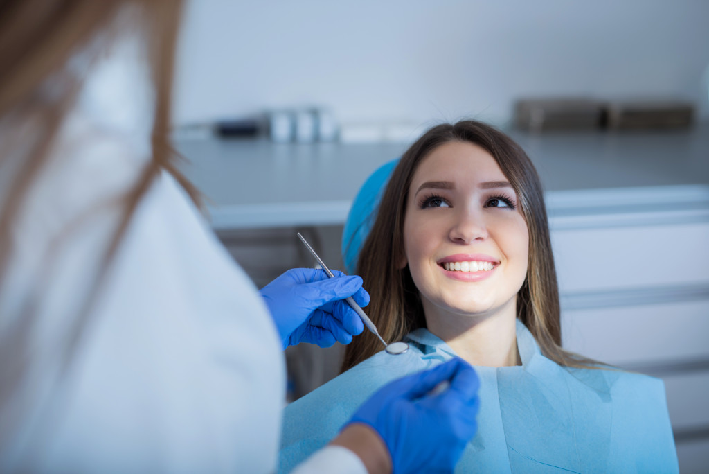 young woman in dental clinic for a checkup or cleaning