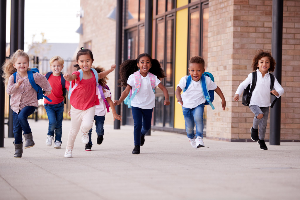 A group of school kids running after school