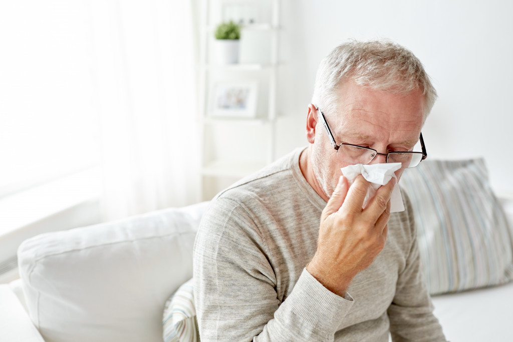 man sneezing