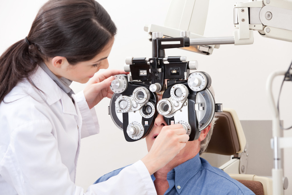 An optometrist checking a patient's eyes