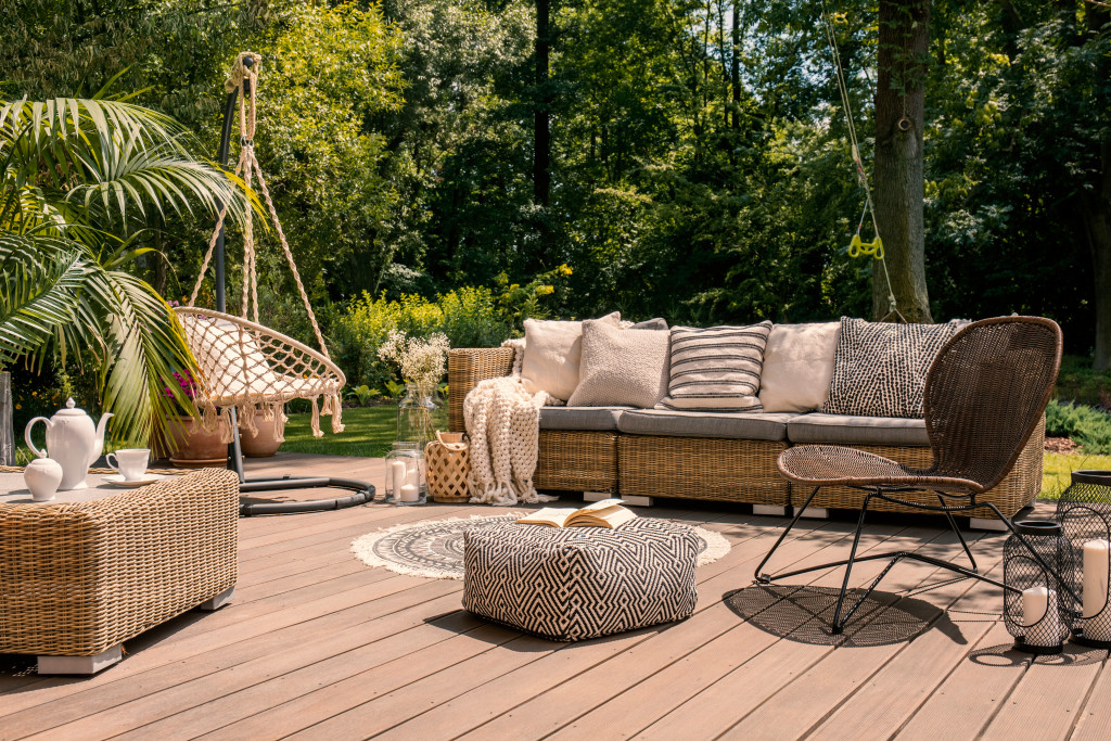 rattan patio with furniture and rug